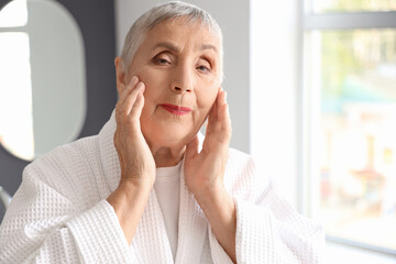 Poster - Senior woman in bathroom, closeup