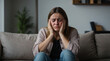 © Edwin - woman sitting on the couch problems with stress, anxiety, illness