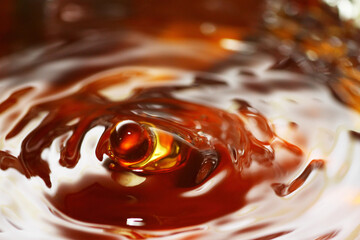 Canvas Print - Macro shot of tea drink ripples as background