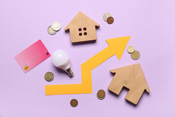 Canvas Print - House figures with light bulb, arrow, coins and credit card on lilac background. Price rise concept