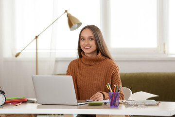 Sticker - Female tutor with laptop giving online lesson at home