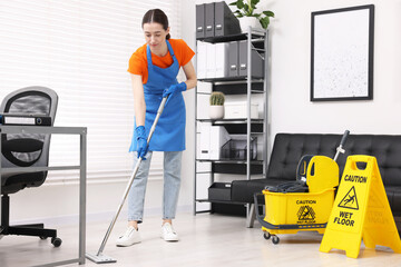 Poster - Cleaning service. Woman washing floor with mop in office