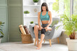 © Pixel-Shot - Sporty young woman with kneecap sitting in armchair at home