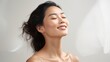 © CStock - Asian woman with a gentle smile and a peaceful aura,
