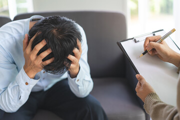 Wall Mural - psychologist talking with depressed patient about mental condition.