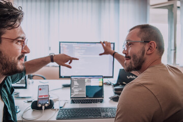 programmers engrossed in deep collaboration, diligently working together to solve complex problems a