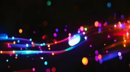 Abstract concept of fiber optic cable with colorful light reflections on a black background