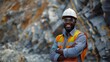 © HikikomorAI - A distinguished African American male engineer smiling with arms crossed, Open-Pit Mine Environment, Risk Mitigation Concept, PPE, Copy Space.