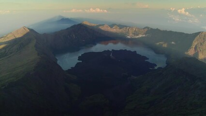 Wall Mural - Aerial view of Rinjani volcano summit in a morning sunrise, Lombok island in Indonesia, Asia