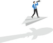 © WS DESIGN - Businessman standing on paper planes and flying with the shadow of the rocket over the wall