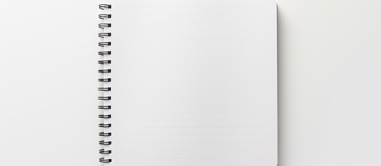 Fototapete - A copy space image of a blank paper notebook or notepad on a white background