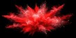 © Sanook - Vibrant red powder dust explosion isolated on background for festive events