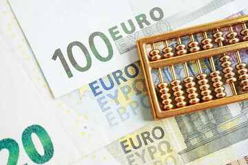 Wall Mural - Gold abacus on banknote money, finance trading investment business currency concept.