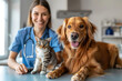 © Liliya - Female veterinarian with a dog and cat on the table