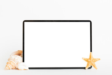 Flat lay composition with tablet and beach accessories on colored background. Tablet computer with blank screen mock up with copy space