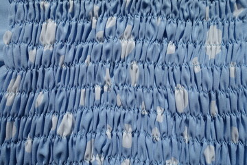 Canvas Print - Surface of  light blue and white rayon fabric with shirring