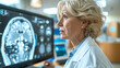 © Alfonso Soler - Female doctor examining x-rays of a cancer patient on the monitor