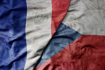 Canvas Print - big waving realistic national colorful flag of czech republic and national flag of france on a euro money banknotes background.