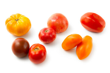 Wall Mural - Assort of different shape and color tomatoes isolated on white background with clipping path. .