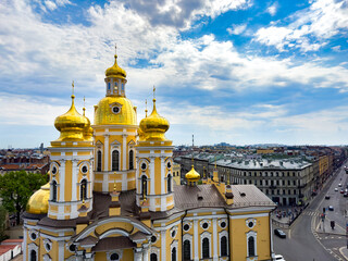 Stunning aerial view of the golden domes of the Cathedral of the Vladimir Icon of the Mother of God in Saint Petersburg. Ideal for travel, architecture, and religious-themed projects.