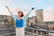 © EdNurg - Experience the vibrant energy of Belgrade with a portrait of a happy tourist exploring Kalemegdan fortress.