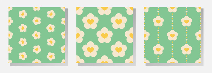 Wall Mural - White and yellow flowers and hearts on green background. Vector seamless patterns collection in soft retro pastel colors.