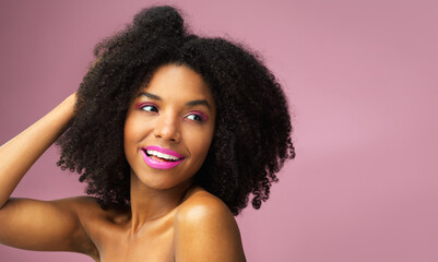 Wall Mural - Girl, smile and hair care in studio with confidence for afro, hairstyle and trendy black person. Woman, happiness and salon on pink background for wellness, shampoo and texture with keratin treatment