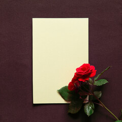 Poster - Flowers red roses with blank empty card on dark brown background