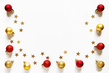 Wall Mural - christmas and new year composition with christmas red and gold balls and gold confetti stars. light 
