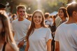 © Odin AI - Young people in white t-shirts having a good time at an outdoor social event, positive emotions visible