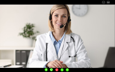 Wall Mural - Online medical consultation. Doctor with headset working via video chat application