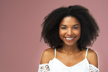 Wall Mural - Afro, haircare and portrait of black woman, smile and studio for hairstyle, growth and texture of hair. Pink background, face and African girl with happiness for treatment in salon and hairdresser