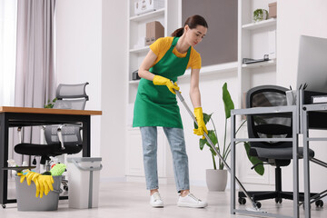 Canvas Print - Cleaning service worker washing floor with mop. Bucket with supplies in office