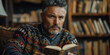 © alenagurenchuk - Middle-aged Latino man calmly reading a book in a library