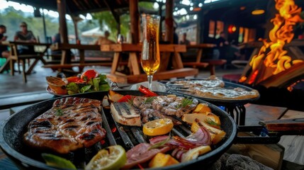 Wall Mural - Outdoor barbecue with grilled meat, vegetables, and a glass of beer at a cozy campsite with a fire pit.