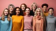 © AS Photo Family - A group of ten multicultural women with different hairstyles and clothes smiling in front of a pink backdrop