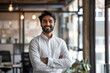 © AI_images_for_people - an Indian corporate leader reflecting professionalism and positivity in a modern startup office.