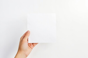 Poster - Hand Holding Blank White Paper On White Background