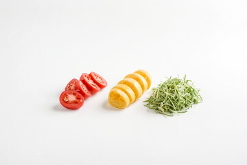 Wall Mural - Sliced Tomatoes, Lemons and Green Onions on White Background