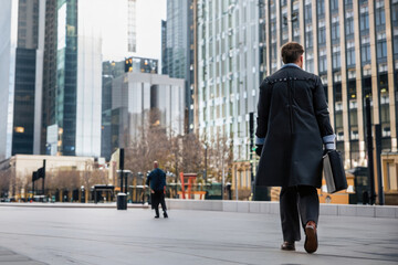 businessman walking the city