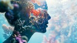 Double exposure of a woman's silhouette with vibrant underwater coral reef, blending human and nature elements.