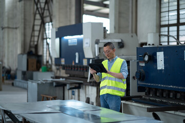 Wall Mural - person working with tablet in workshop