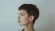 © Roodic - A serene portrait of a woman with short hair looking thoughtfully to the side
