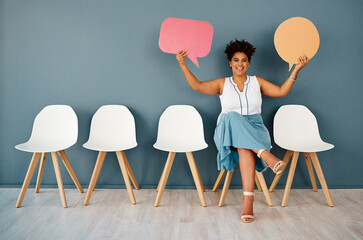 Canvas Print - Woman, waiting room with speech bubble and wall background, portrait and chairs for appointment. Hiring, feedback or recruitment in modern office workplace, communication and language translation