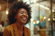 © AlfredoGiordano - close up portrait of a happy young black lady laughing of joy inside a bar