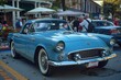 © Popelniushka - Show Car: Classic American Car Shining in Historic City Traffic