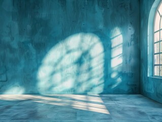 Wall Mural - A blue room with a window and a shadow on the wall. The room is empty and has a very clean and modern look