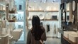 © Anna - Person in a showroom choosing bathroom fixtures for their home renovation