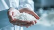 © Serhii - Material Plastic. Engineer holding Pet Polymer Bead for Chemical Design in Laboratory