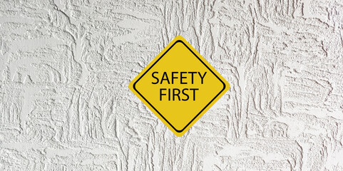 Wall Mural - Safety first symbols, work safety, caution work hazards, danger surveillance, zero accident concept. Wooden cubes with smart grey background. Employees safety awareness at workplace. Safety banner.